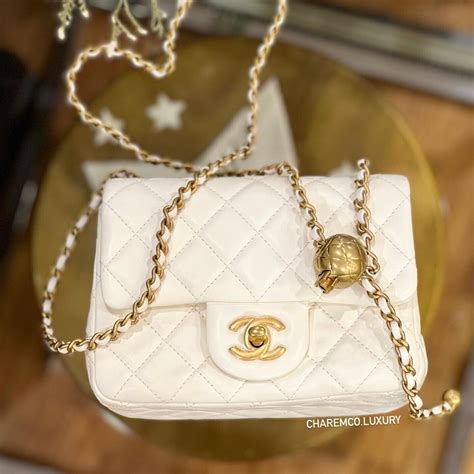 white chanel bag with black chain